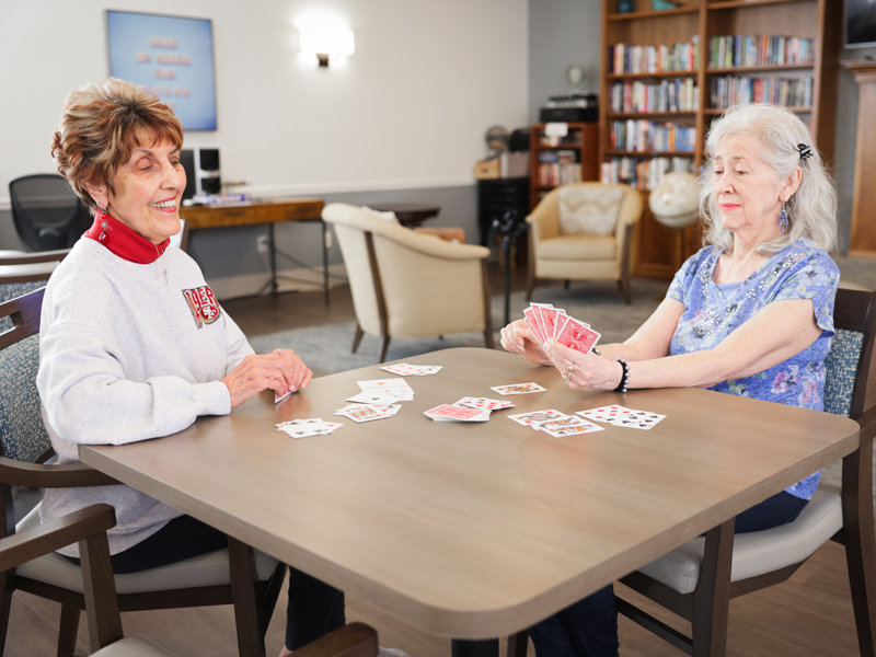 residents playing cards assisted living